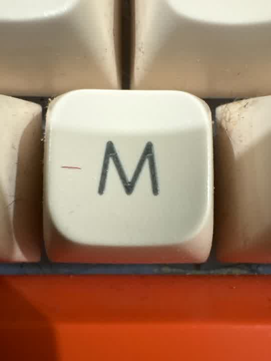 M.